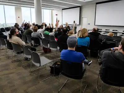 A speaker sharing their experience with the community